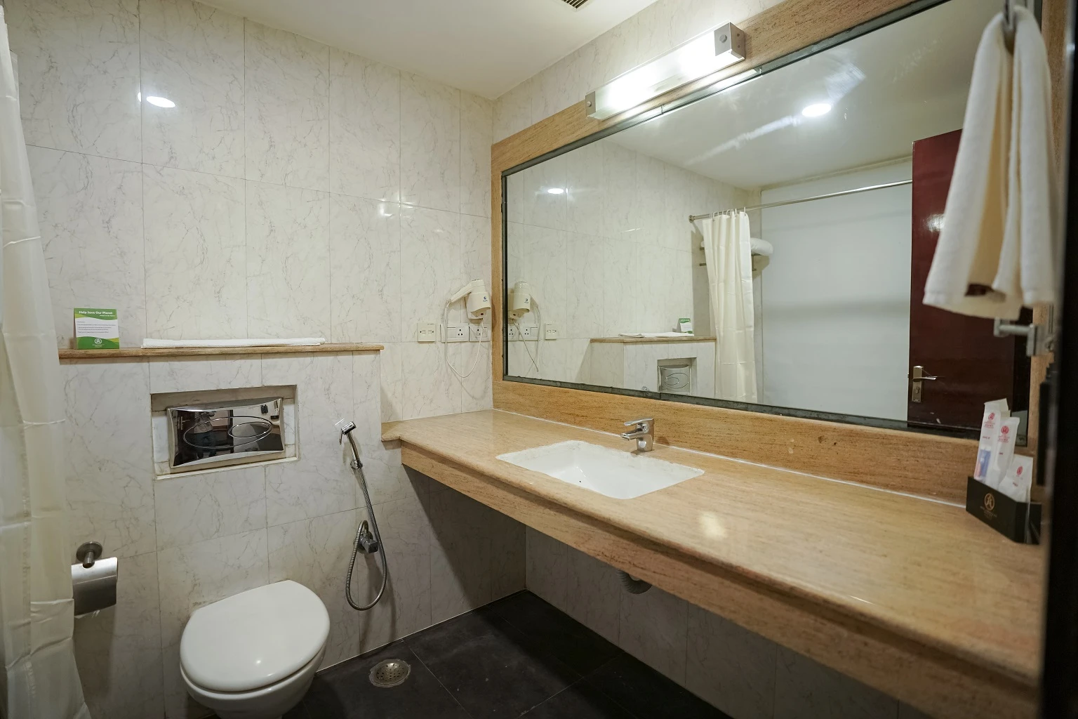 Modern bathroom in deluxe room at Amber Palace Hotel Gurgaon