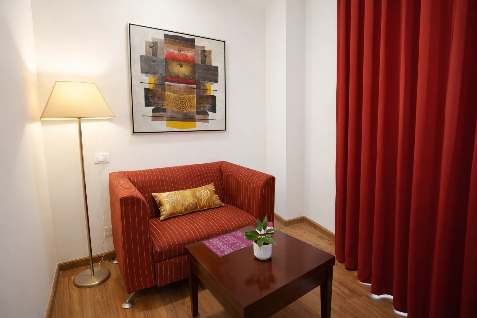 Seating area in deluxe room at Amber Palace Hotel Gurgaon