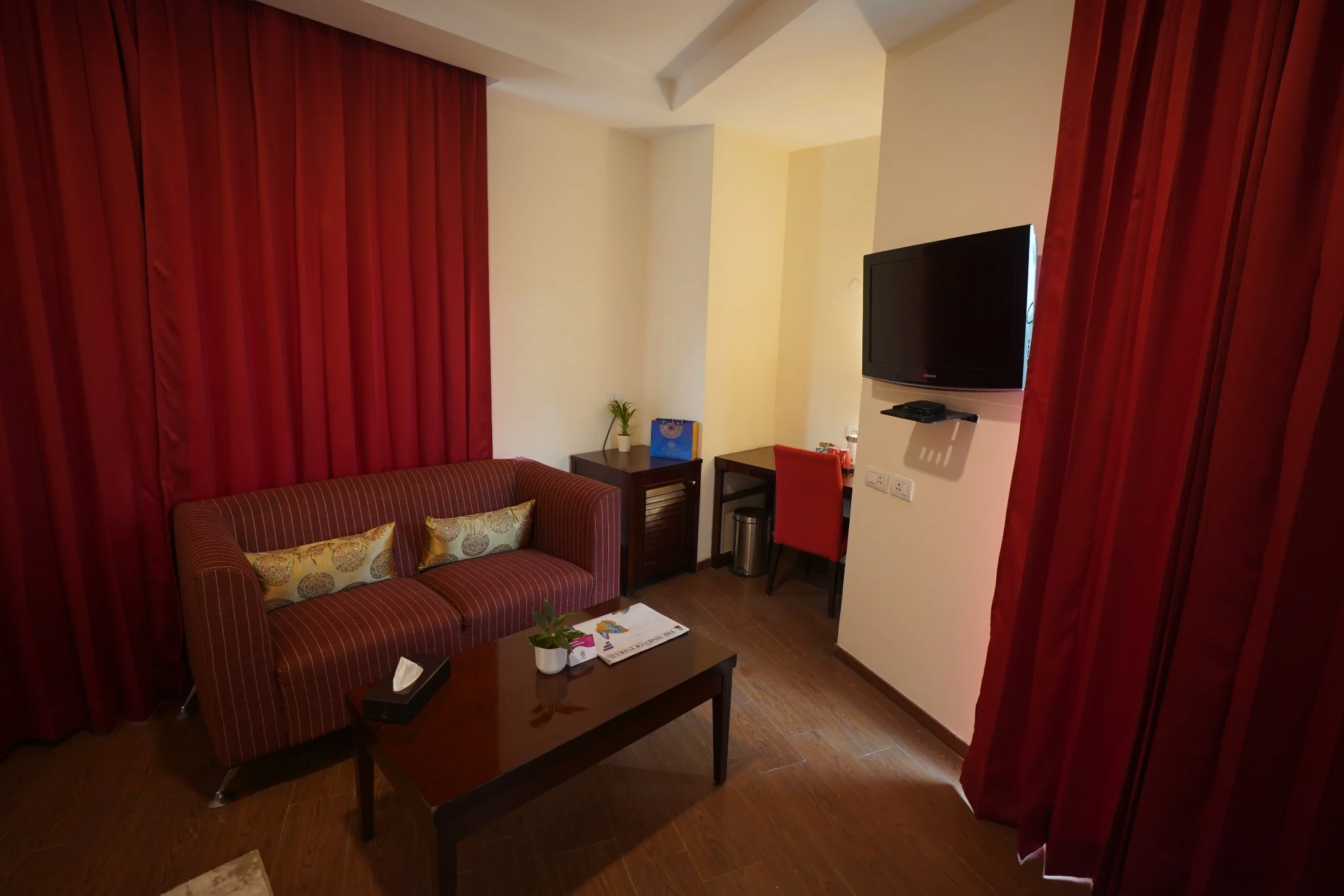 Seating area in deluxe room at Amber Palace Hotel Gurgaon